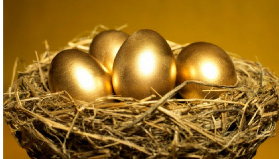 golden eggs sitting in a nest